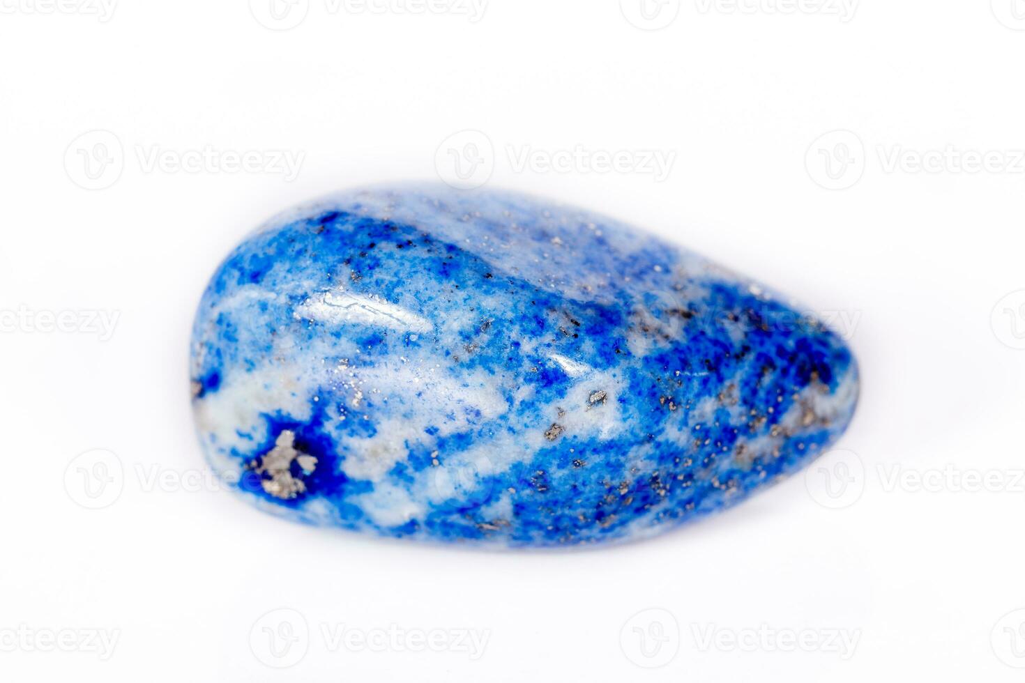 Macro mineral stone blue lapis lazuli afghanistan on white background photo