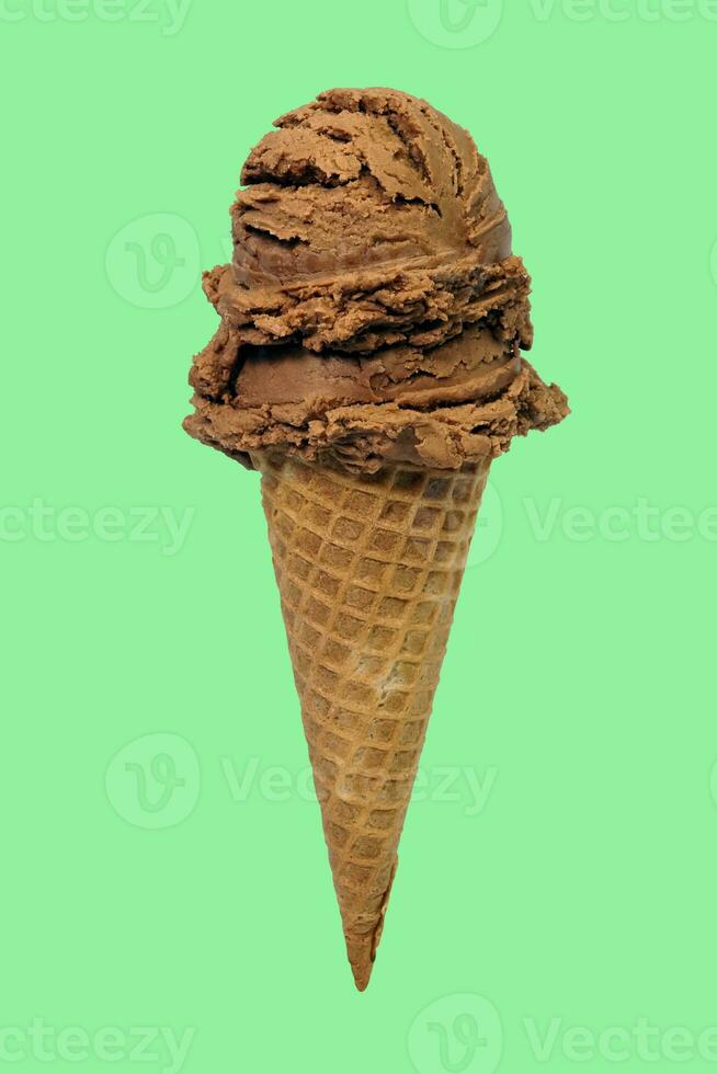 double scoops of chocolate ice cream cone isolate with green background photo