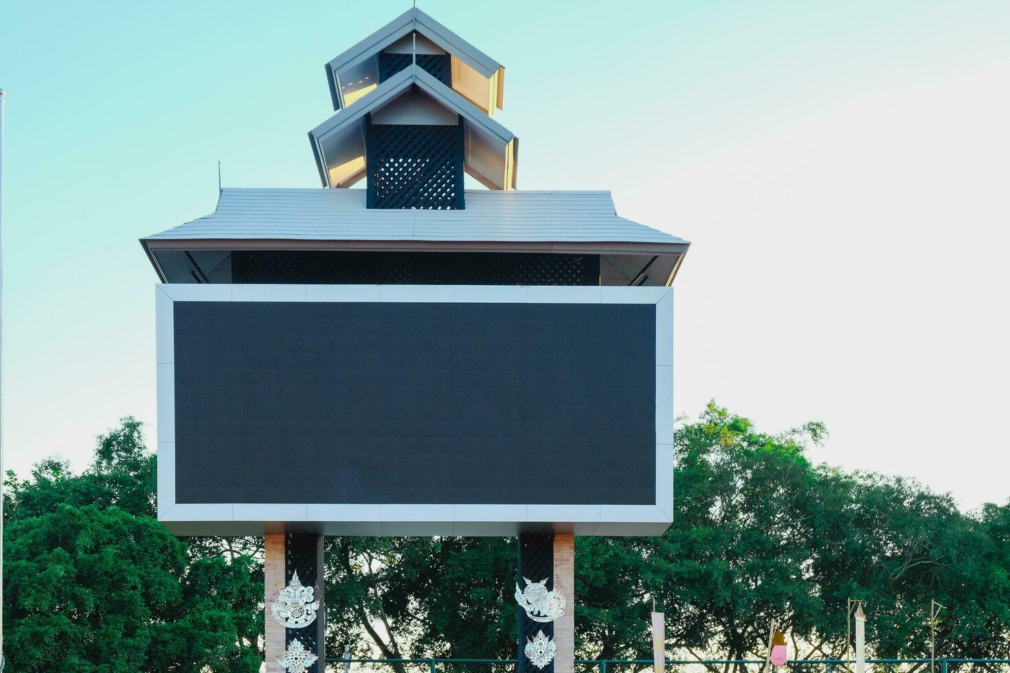 Blank advertising board with roof outdoor. photo