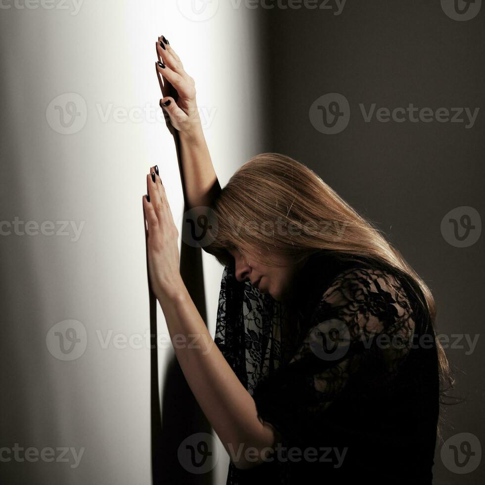 Depressed woman with her head down photo