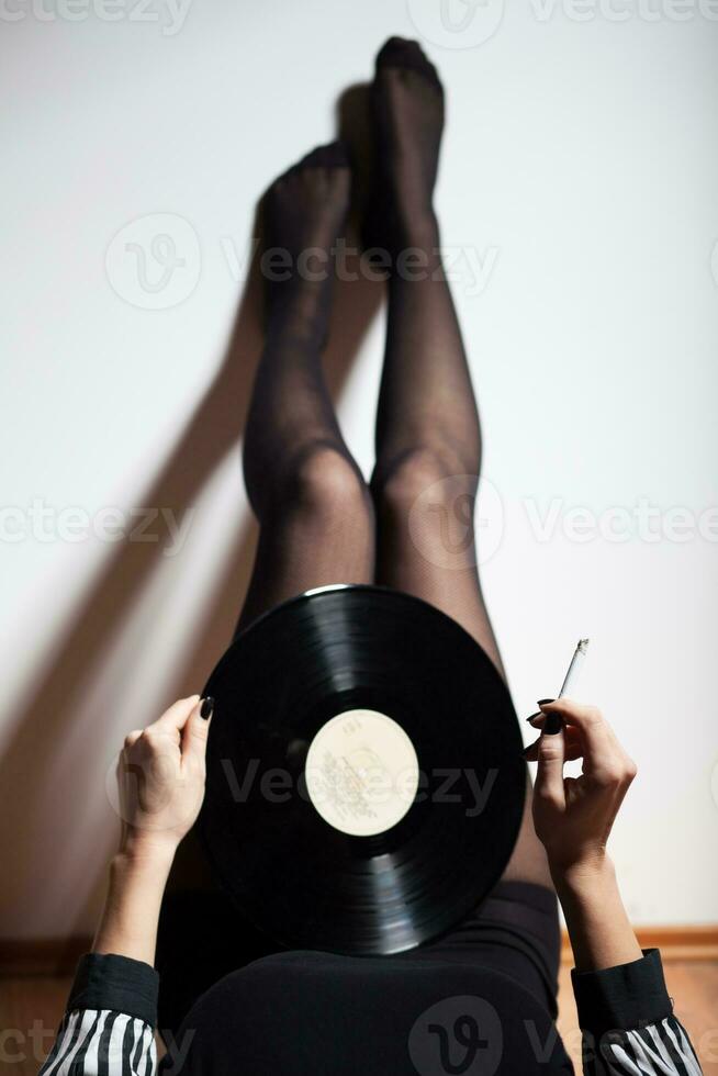 Legs with vinyl record photo