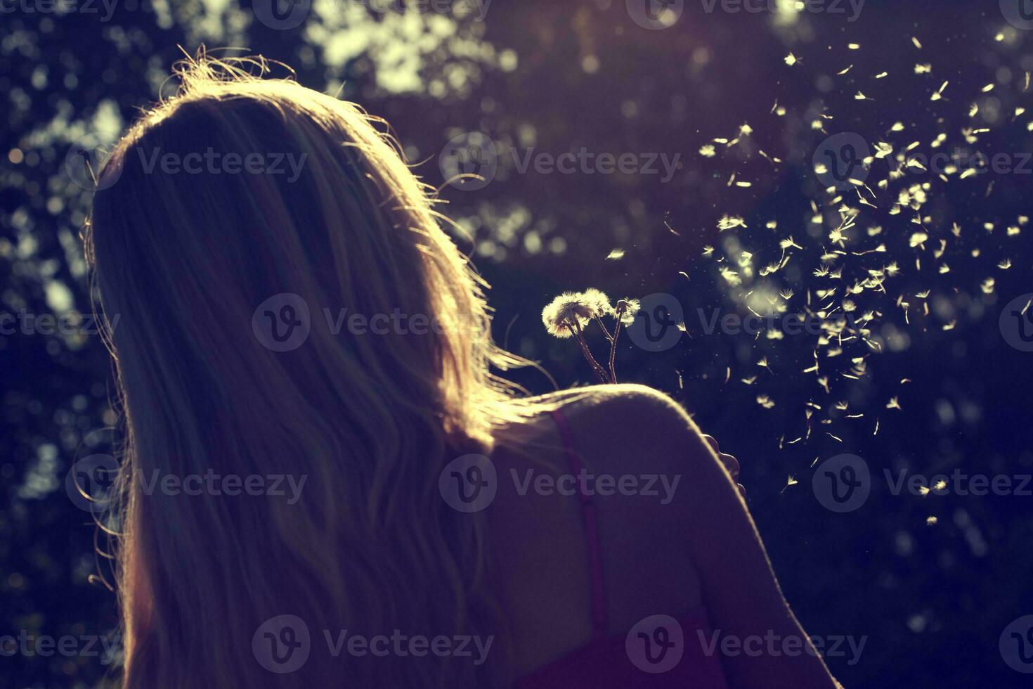 Young woman holding a flower photo