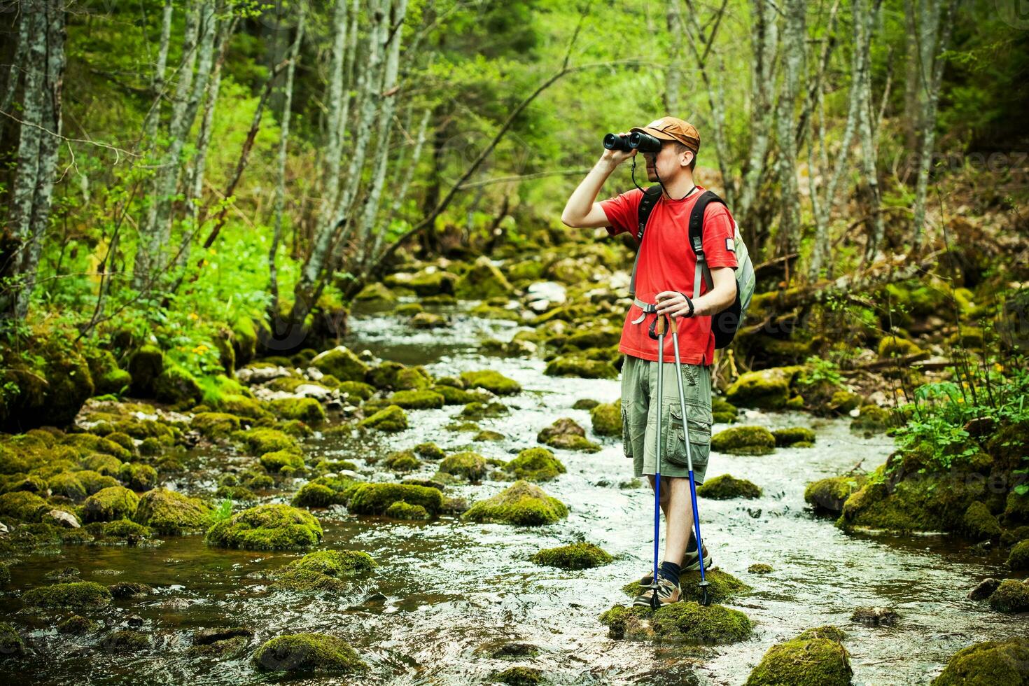 Man hiking with binoculars photo