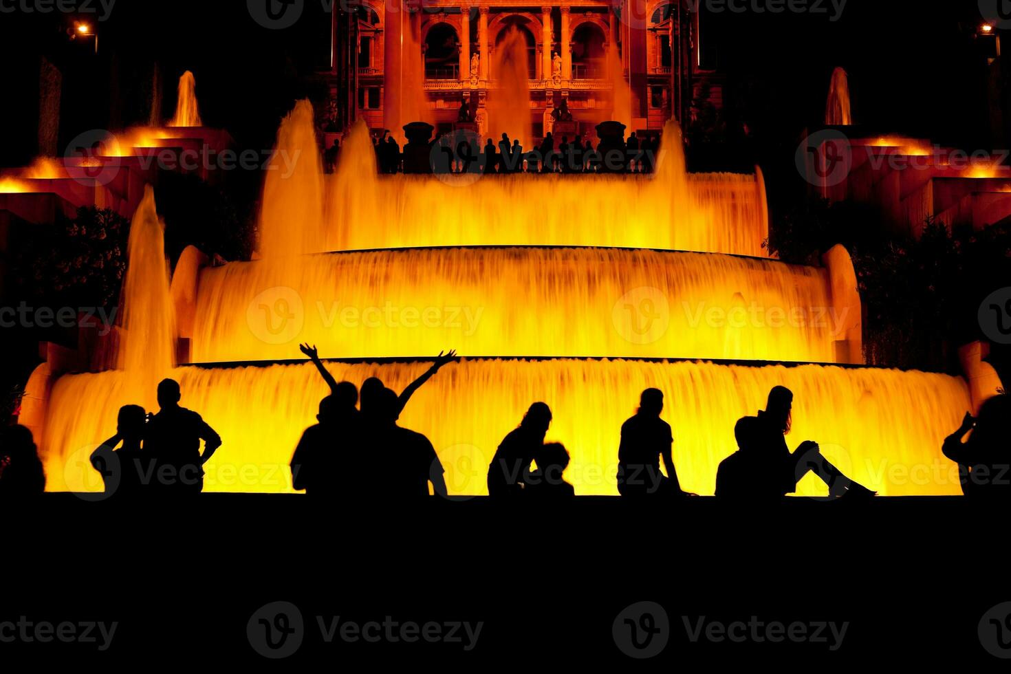 Tourist enjoy their time in front of the fountain in Barcelona photo