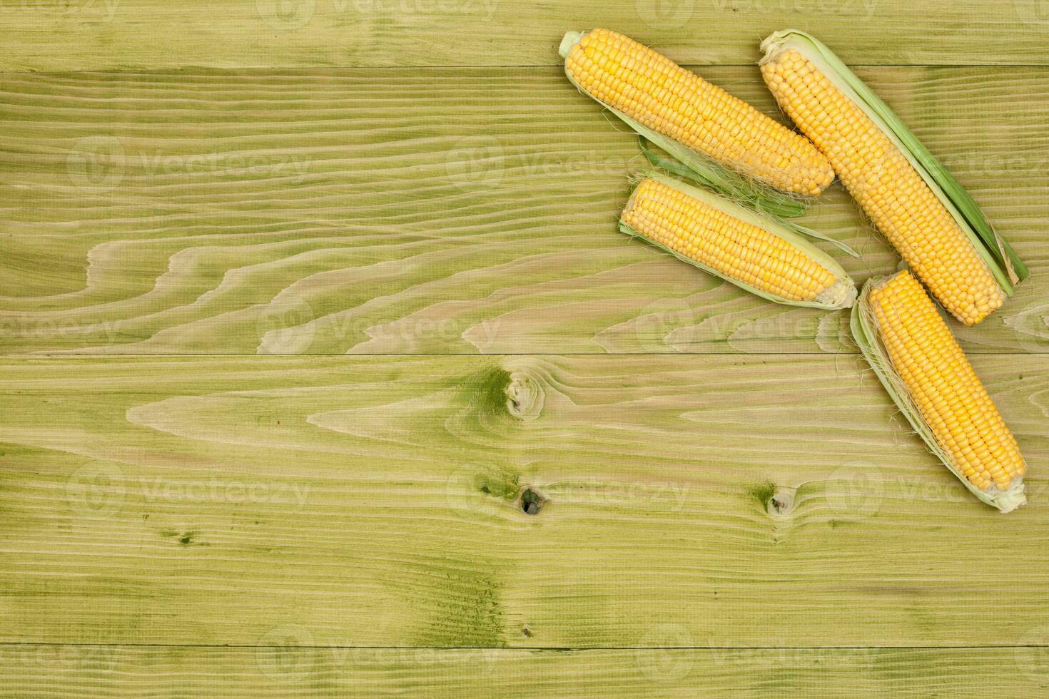 Organic corn on wooden board photo