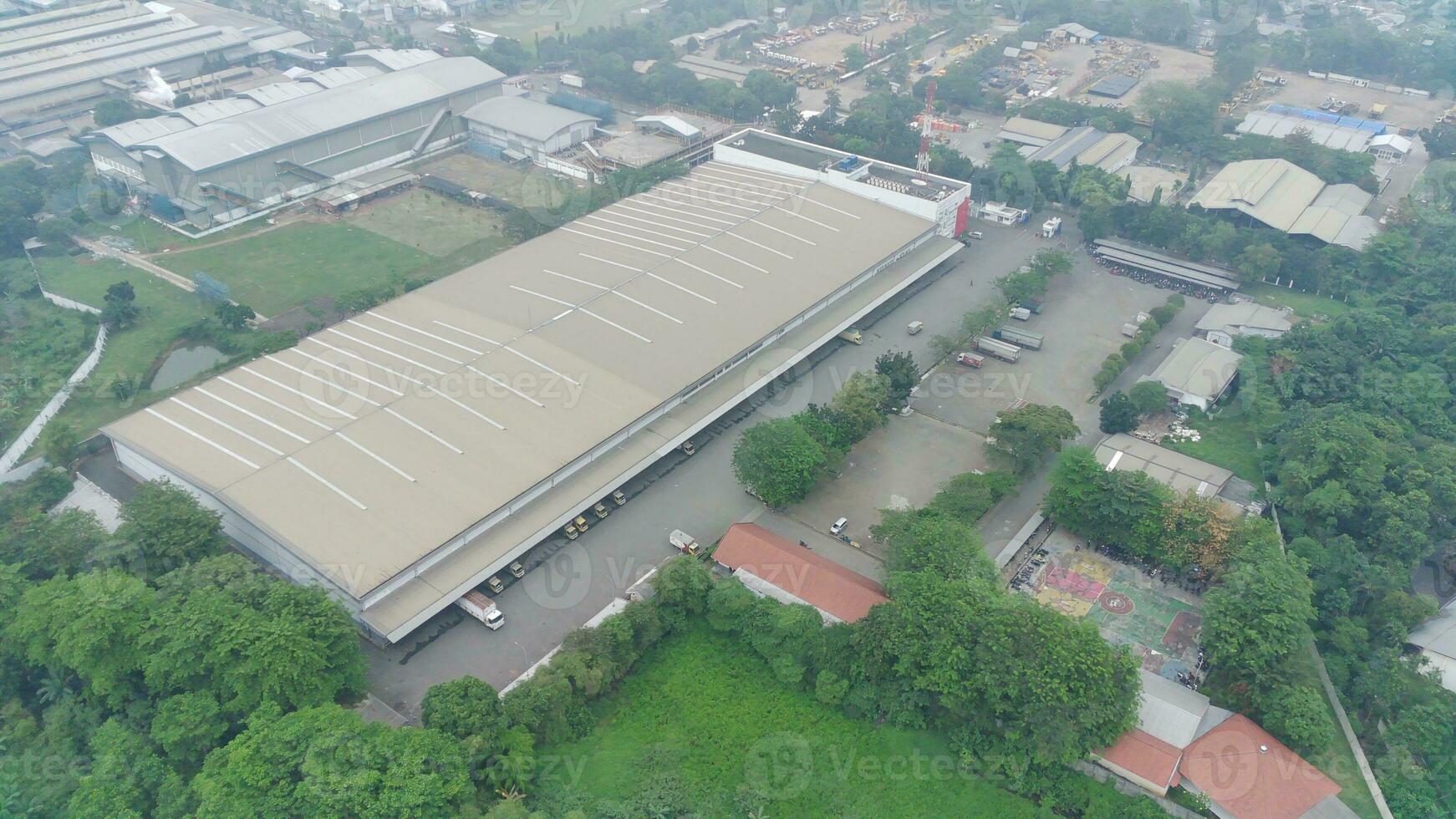 aerial view of office building and warehouse distribution center of retail based company at daytime. photo