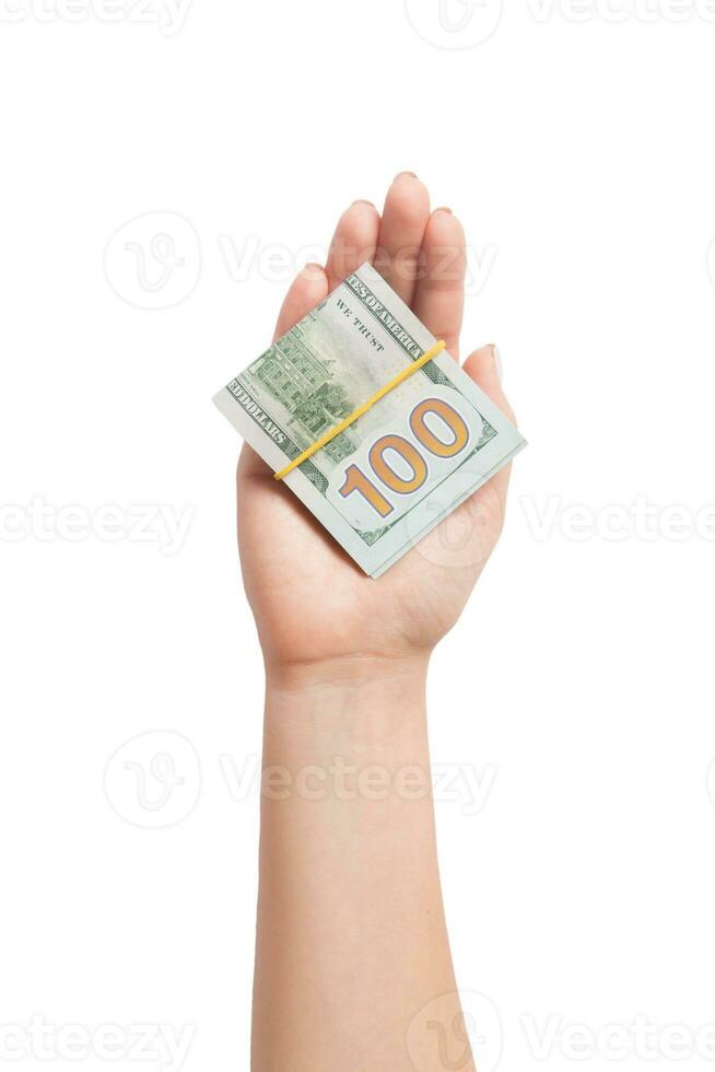 Top view of dollar bills in tubes in female hand on white isolated background. Business concept photo