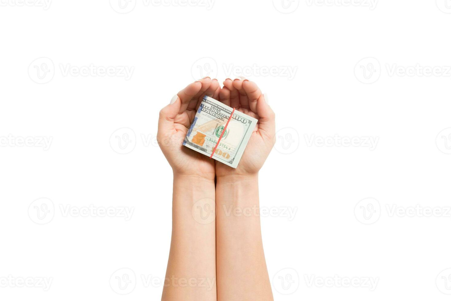 Top view of dollar banknotes in female hands on white isolated background. Retirement and poverty concept photo