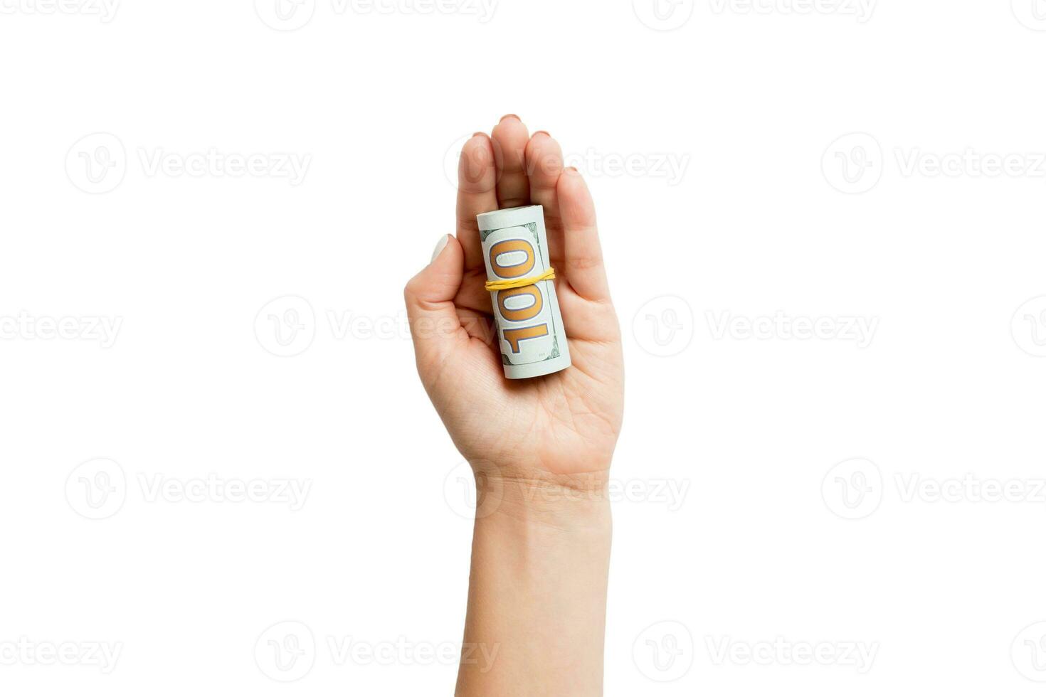 Top view of dollar bills rolled up in tubes in female palm on white isolated background. Retirement concept with copy space photo