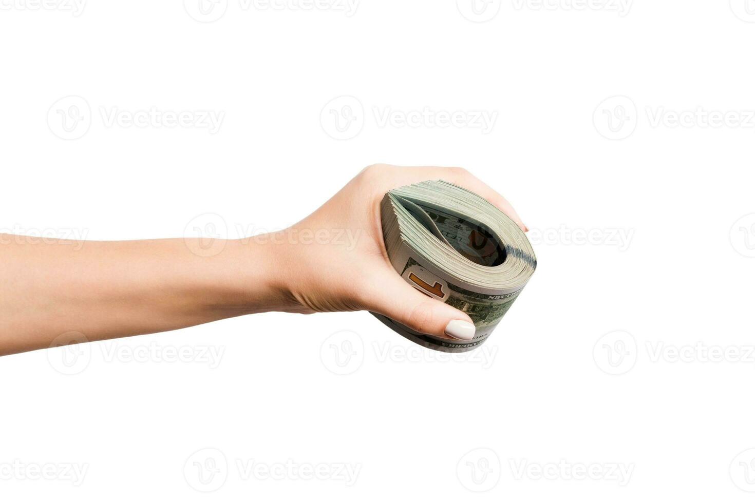 Isolated image of female hand holding a bundle of dollars on white background. Payment concept photo