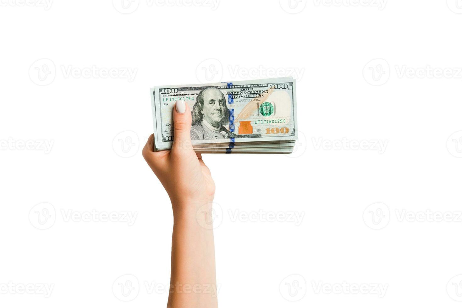 Top view of dollar banknotes in female hand on white isolated background. Business concept photo
