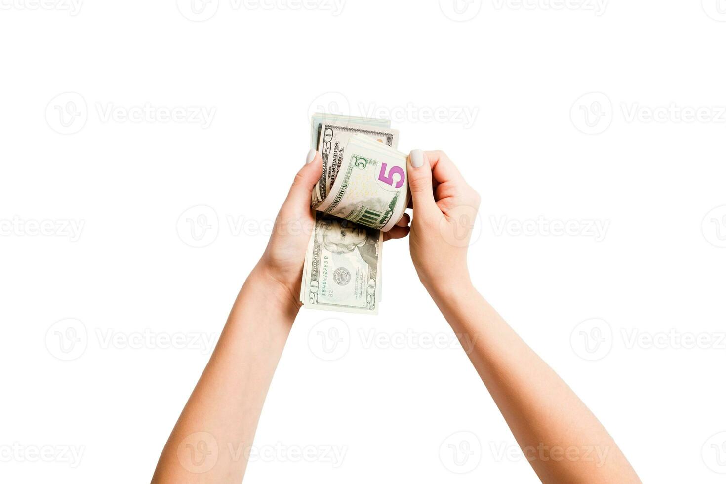 Top view of female hands counting dollar banknotes on white isolated background. Investment and prosperity concept photo