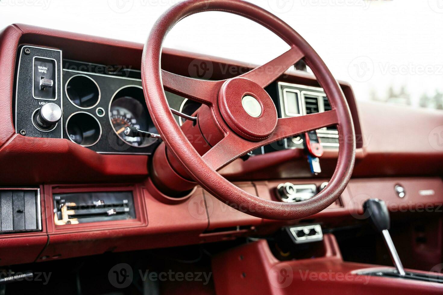 red steering wheel, dashboard of an old powerful classic American car photo