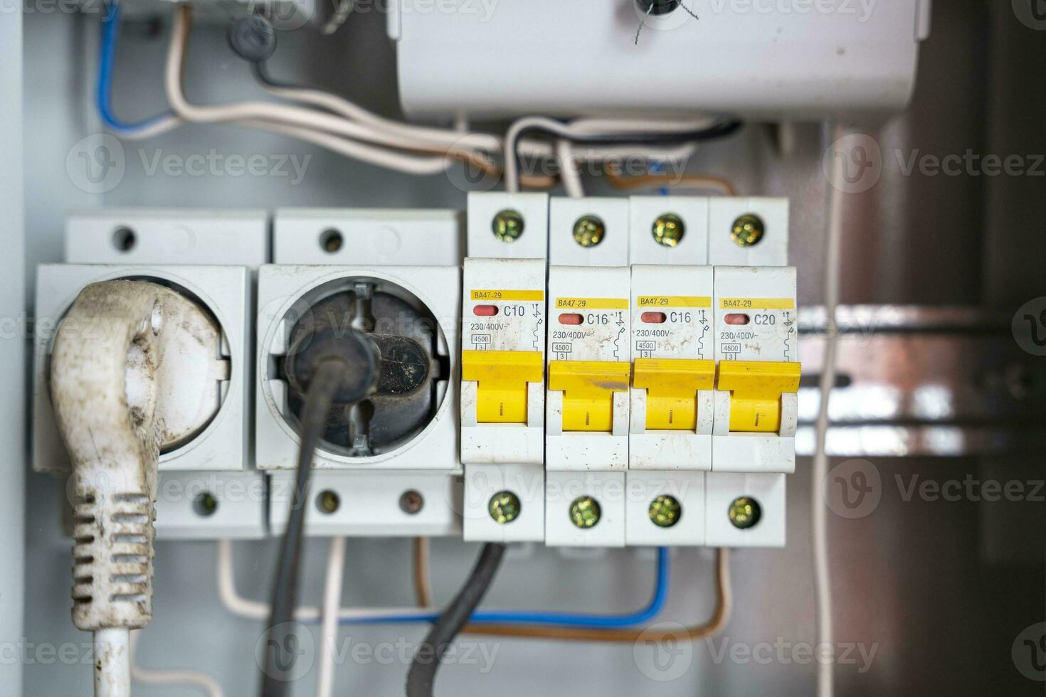 electrical panel with sockets and circuit breakers with wires photo