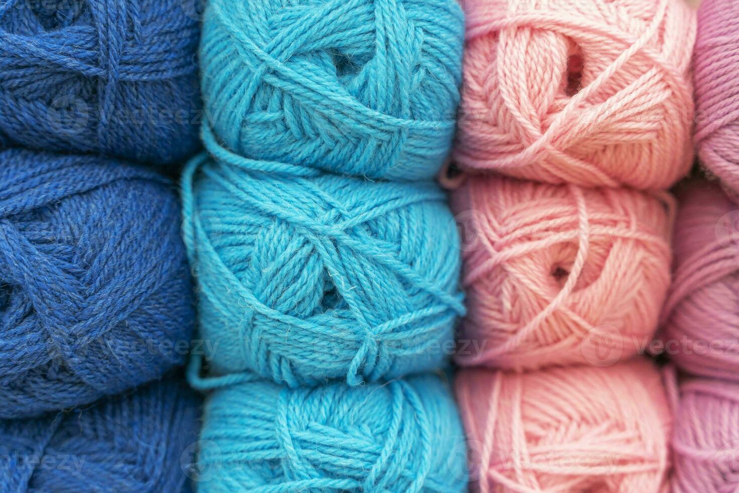 tangles of multicolored thick woolen threads. background. knitting photo