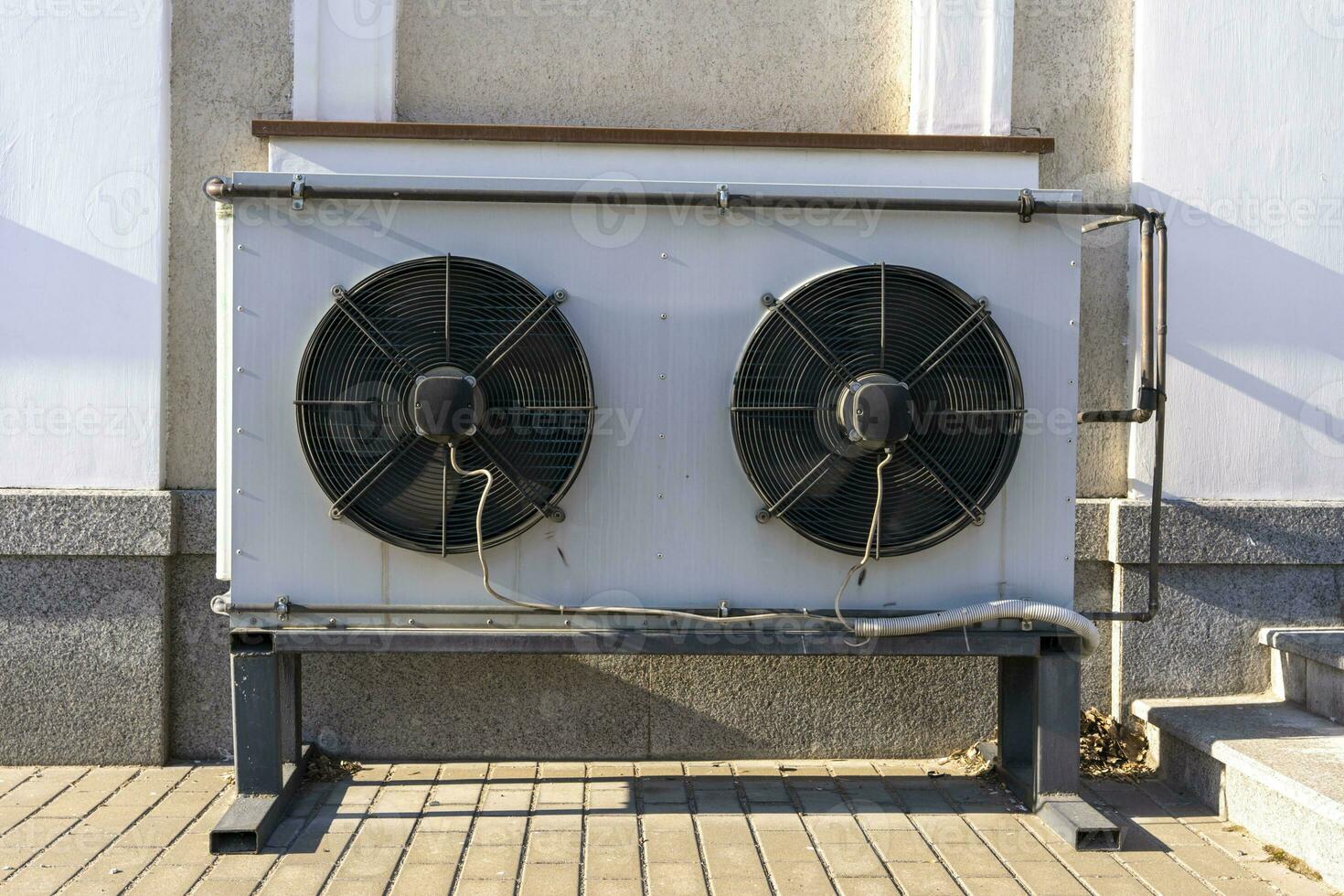 air conditioning unit on the facade of the building refrigeration fans photo