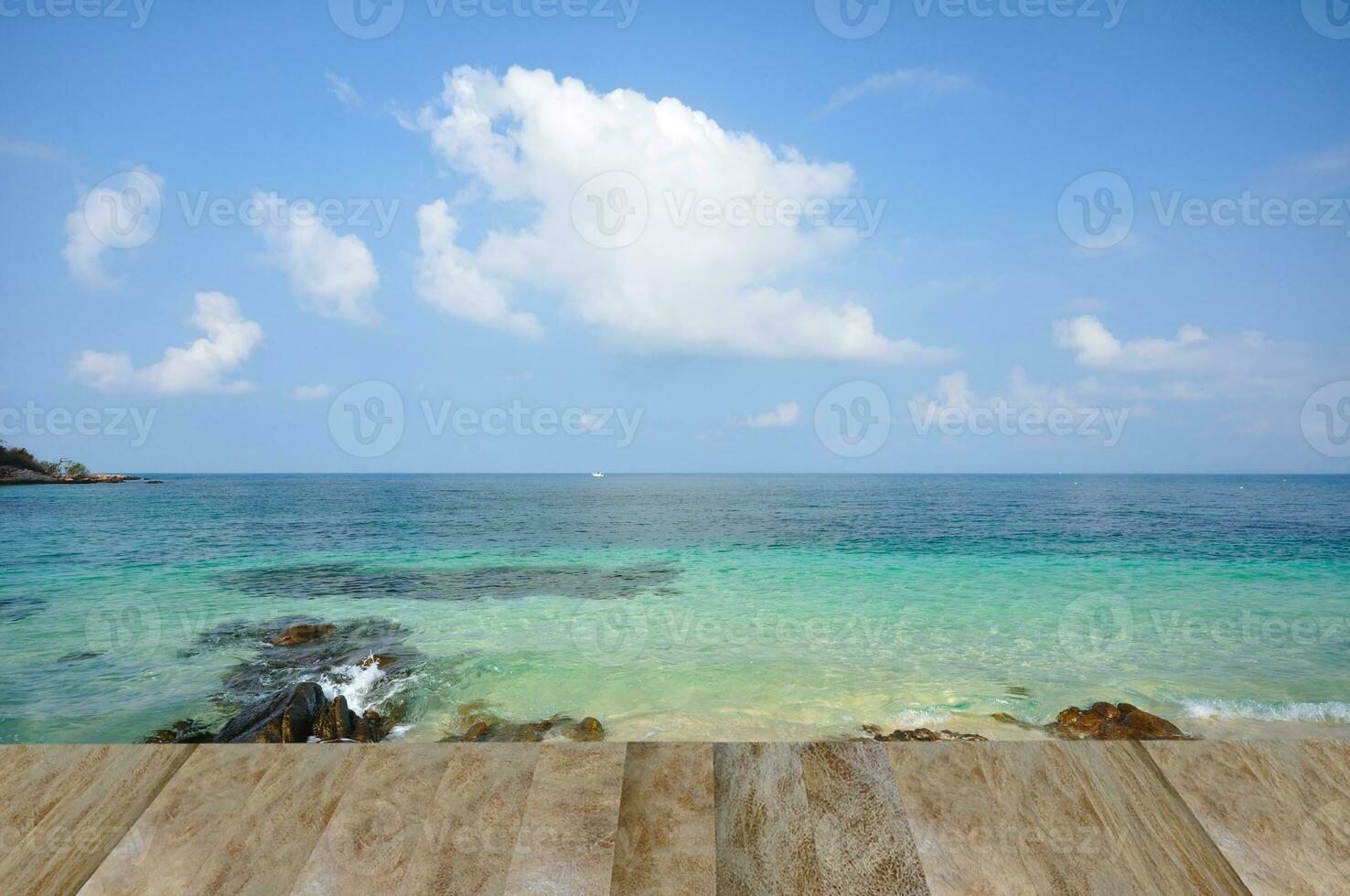 wooden walkway in the beach with nice sea view. photo