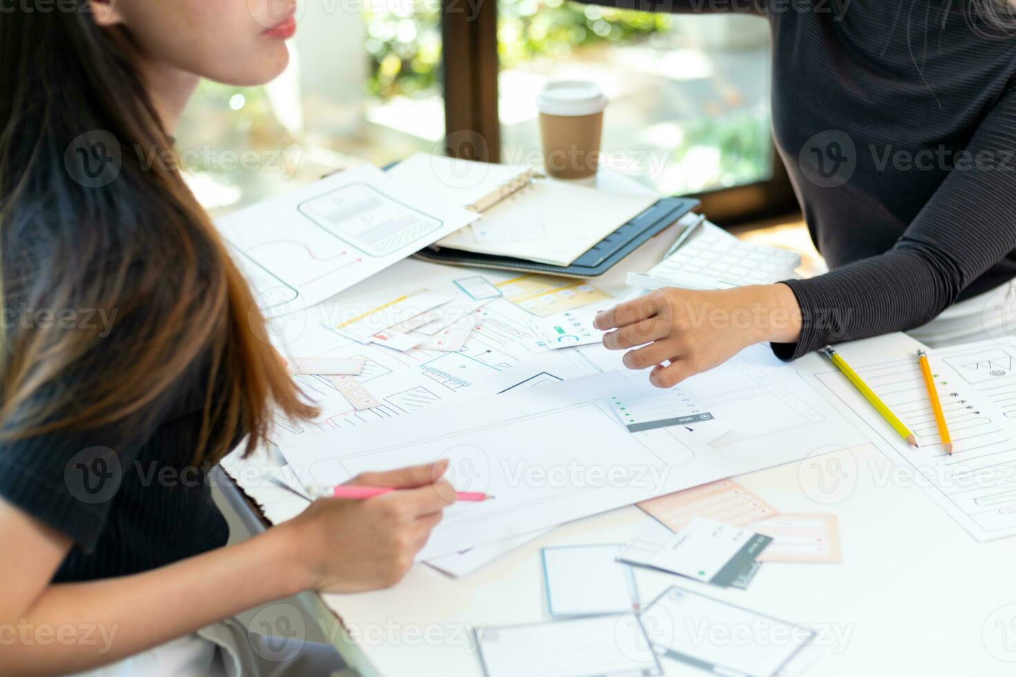 Mobile application developers are designing a ux ui system to make the display on the phone screen go smoothly because the ux ui system in a mobile phone affects the operation of various applications. photo