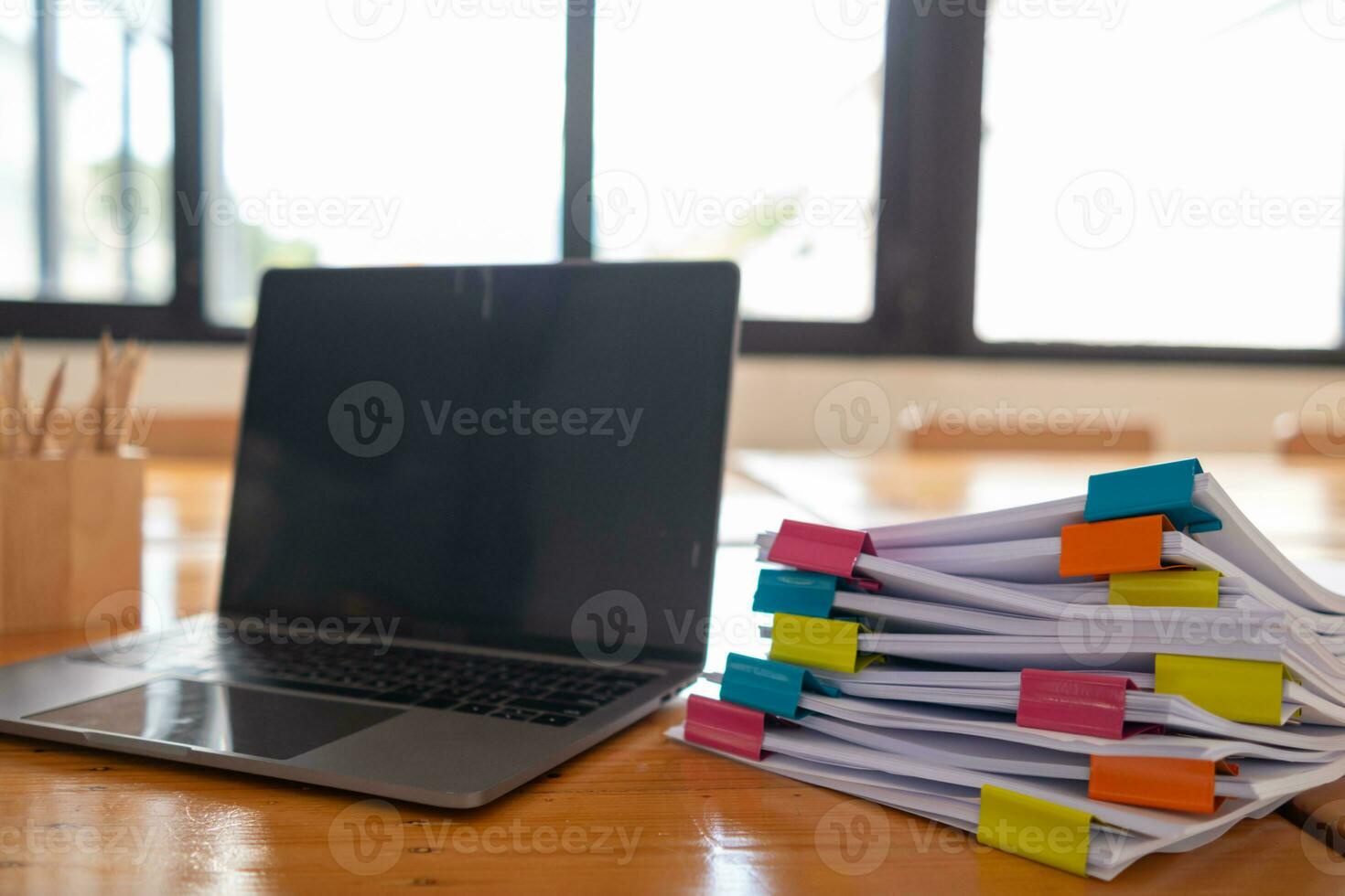 Businesswoman hands working on stacks of paper documents to search and review documents piled on table before sending them to board of directors to use  correct documents in meeting with Businessman photo
