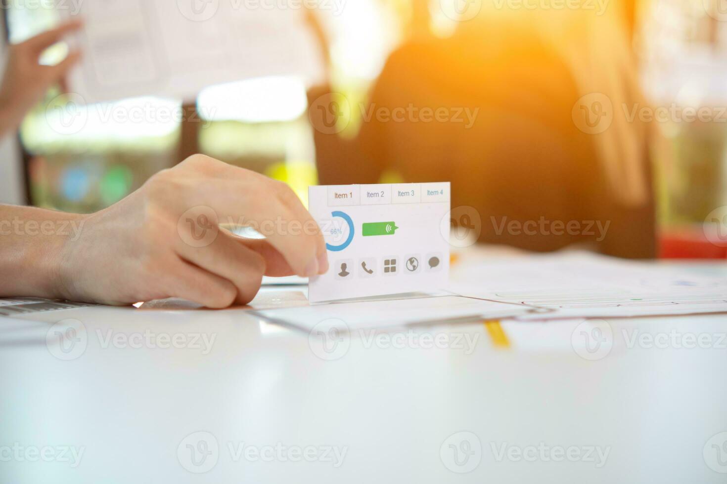 Mobile application developers are designing a ux ui system to make the display on the phone screen go smoothly because the ux ui system in a mobile phone affects the operation of various applications. photo