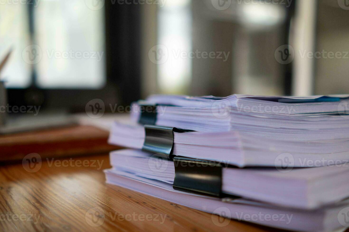 Businesswoman hands working on stacks of paper documents to search and review documents piled on table before sending them to board of directors to use  correct documents in meeting with Businessman photo