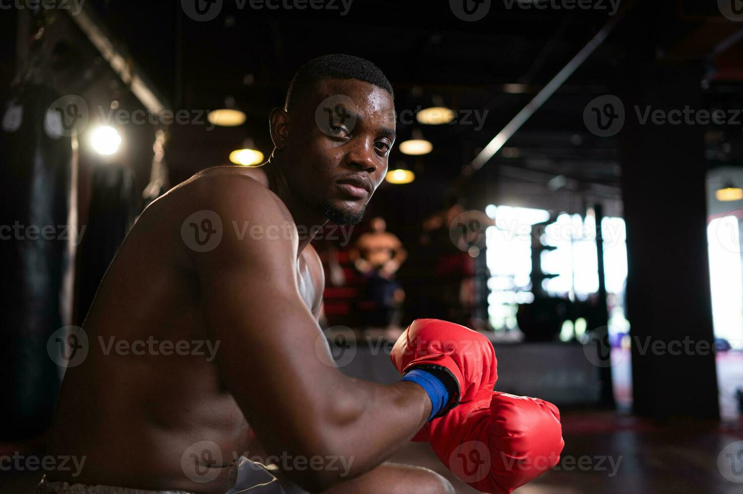 Portrait of boxer preparing to fight on stage to gain experience in the use of Muay Thai martial arts photo