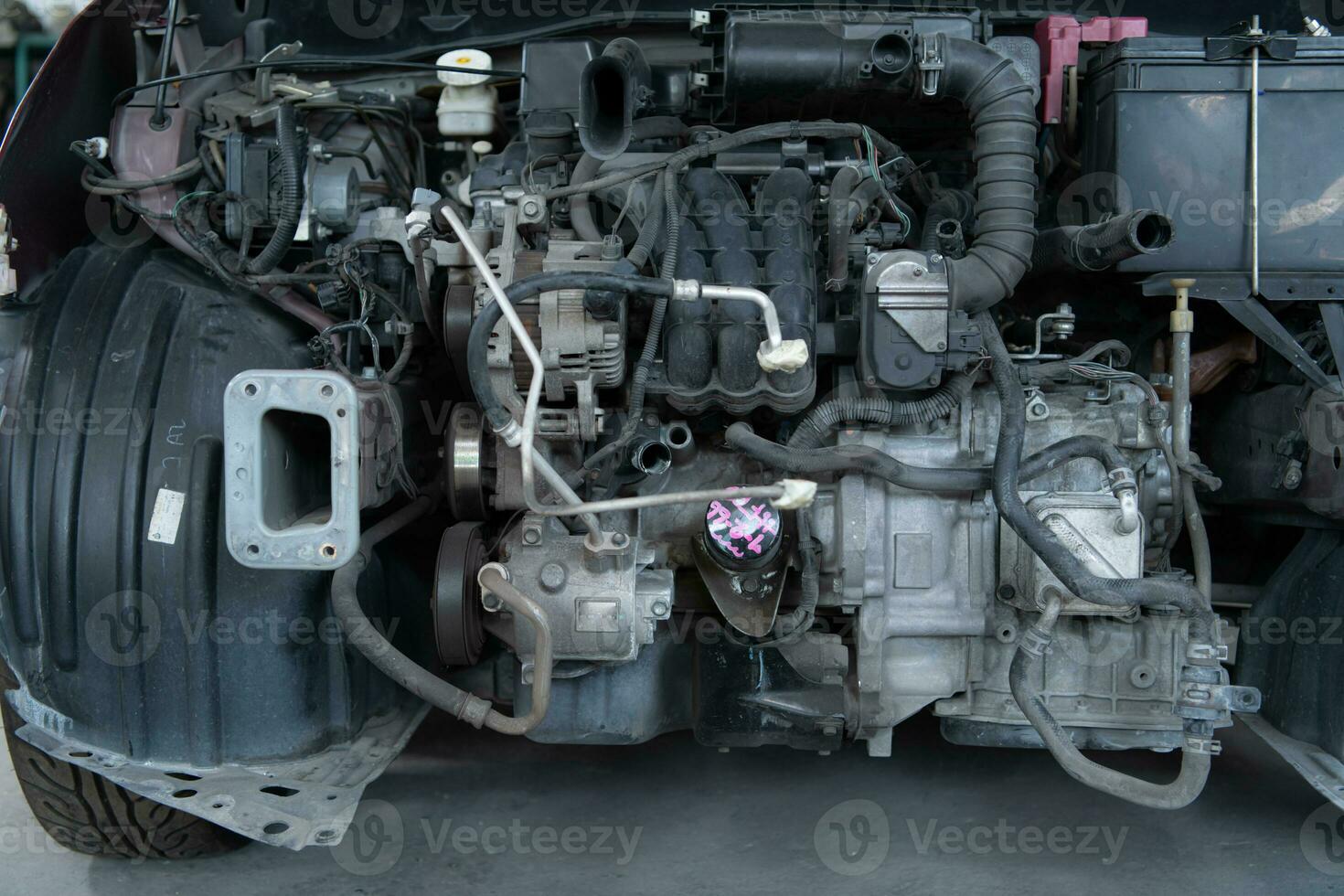 The engine of a car that has been hit hard. Professional technicians repair until it is in normal working condition. photo