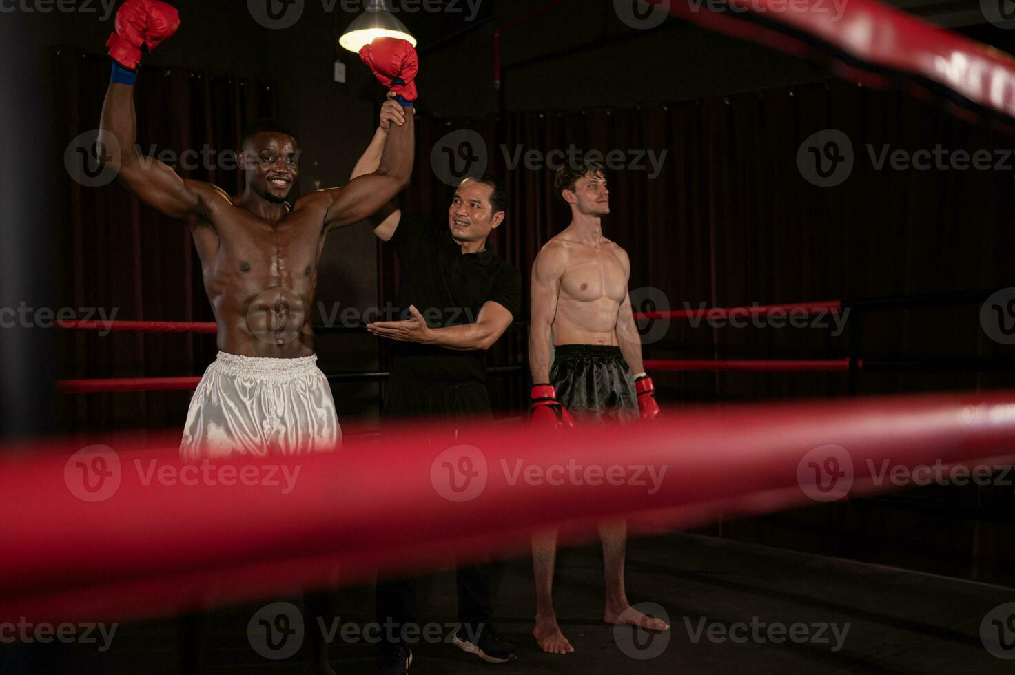 Victorious boxer the referee will raise their hands on stage, Muay Thai, Thai martial arts. photo