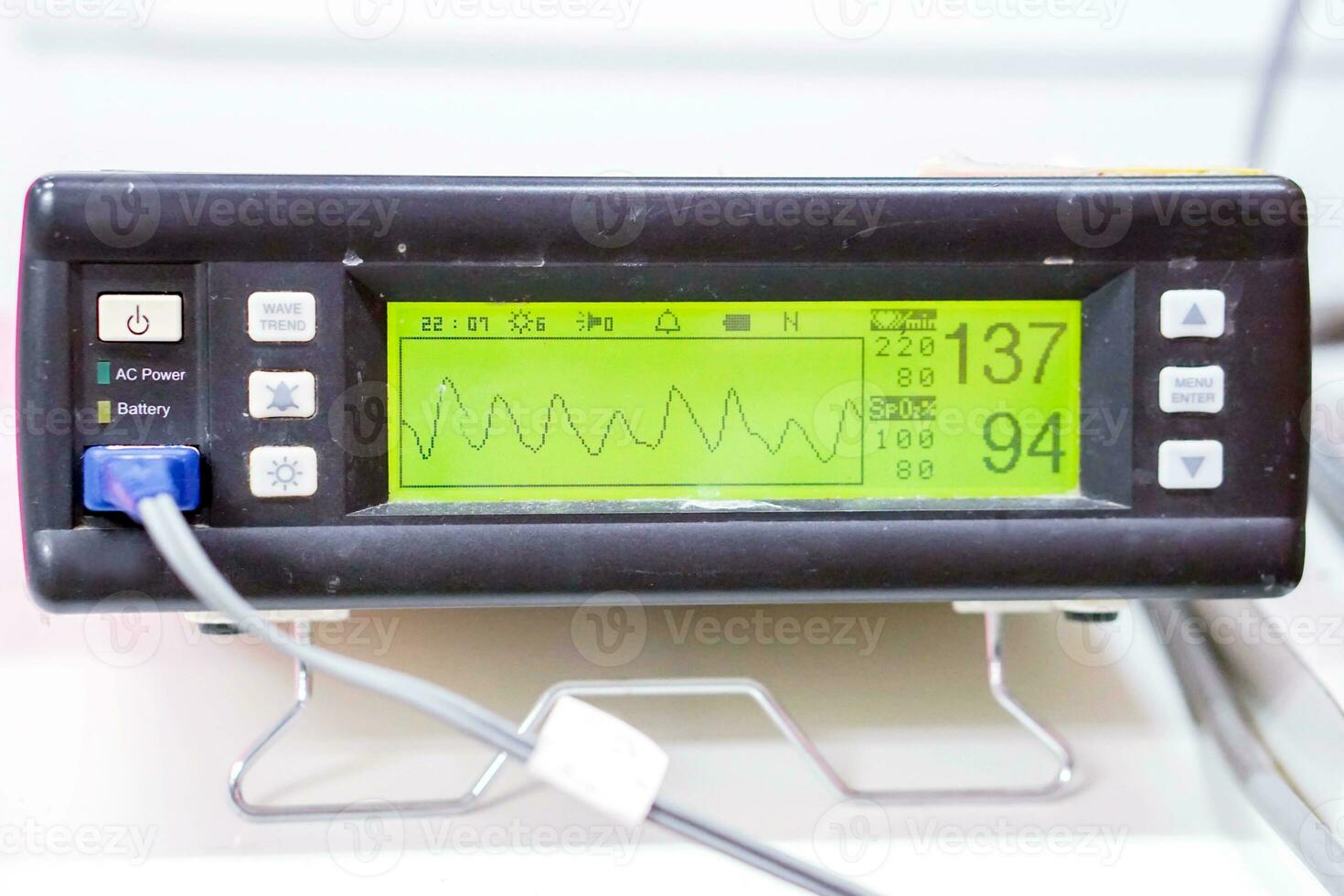 Measuring Oxygen blood saturation device and Pulse Oximeter display for patient in a hospital. Pulse Oximeter display is device used to monitor the symptoms of patients with oxygen deficit problems. photo