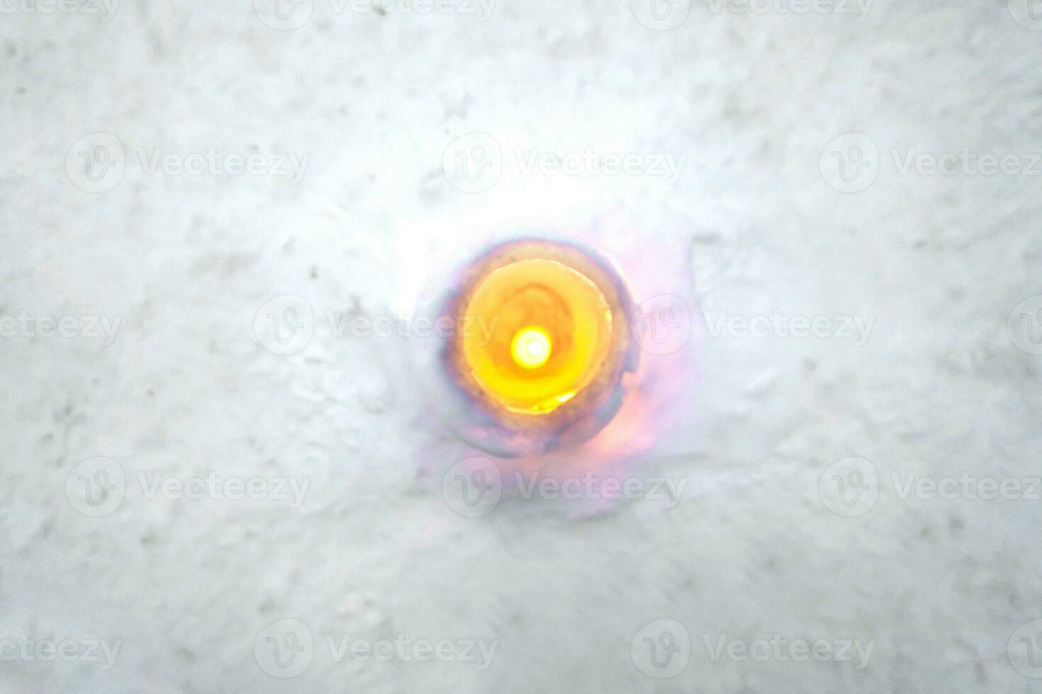 Top view of snow and ice candle on snow floor background. Snow candles are activities of The Otaru Snow Light Path Festival at Otaru, Hokkaido prefecture, Japan. photo