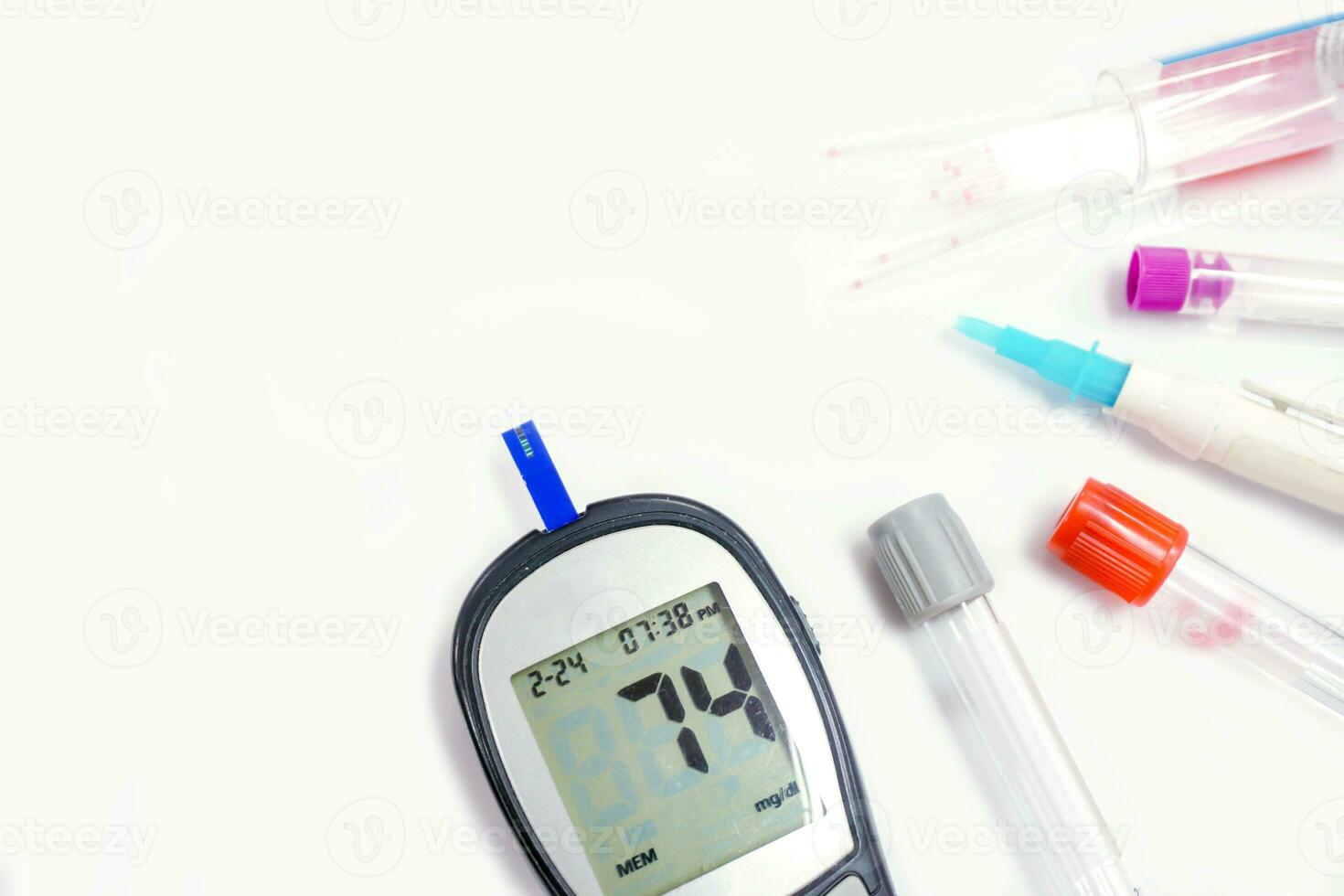 Top view glucose meter machine and numbers of glucose in the blood show on screen with sheet check, Blood tube, Needle pen, and medical capillary glass tubes isolate on white background. photo