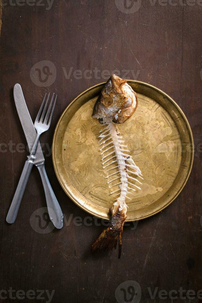 Fish skeleton in plate photo
