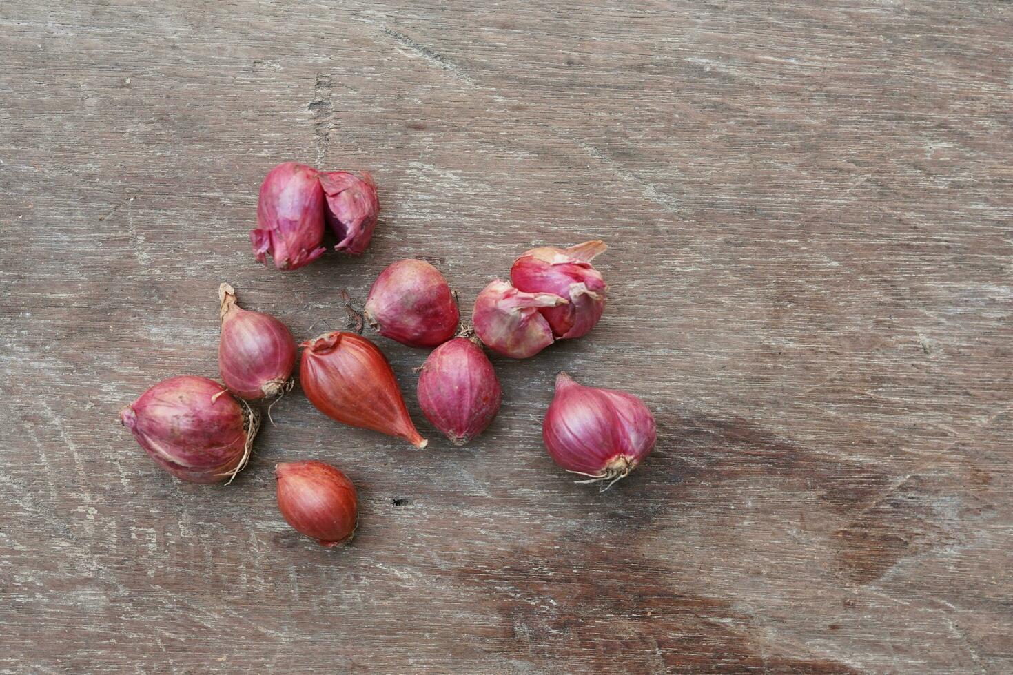 herbs. onion on a wooden board ready to be processed. Top view photo