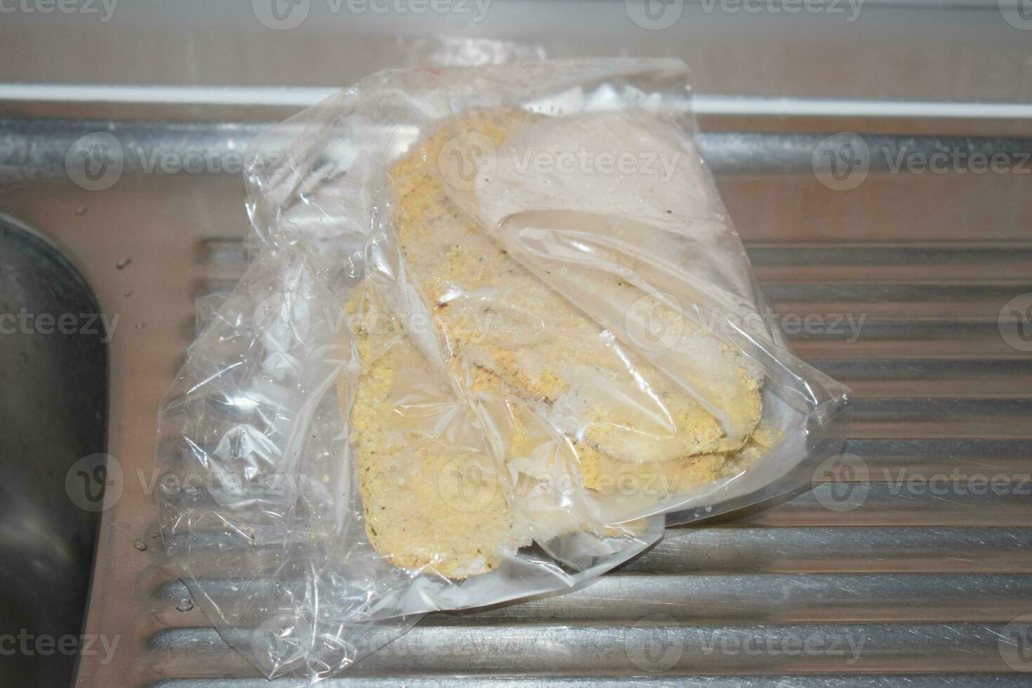 Frozen Schnitzel in a Plastic Bag photo