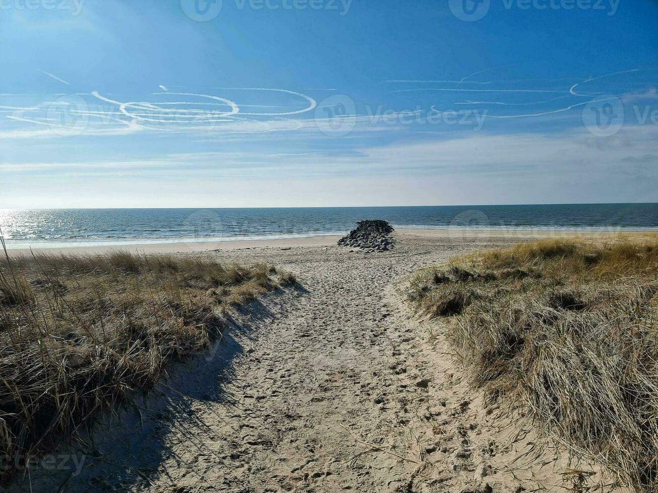 the endless beach at the northern sea Hvidbjerg Stranden Blavand Denmark photo