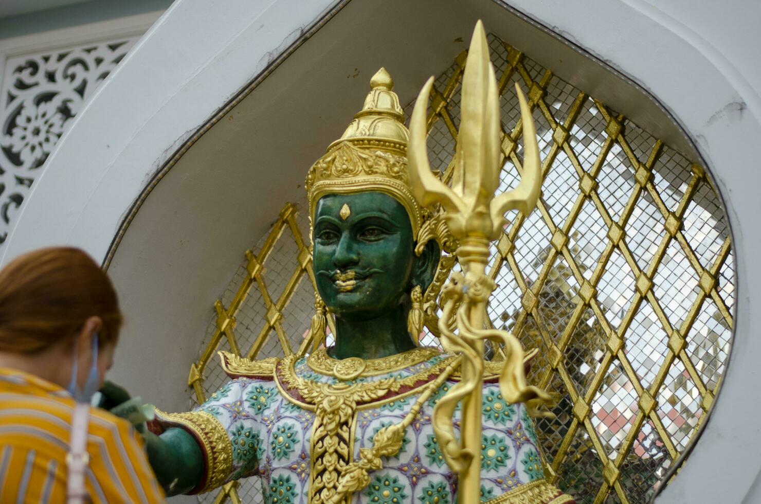 Bangkok, Thailand - April 22, 2023 Devaraj Neramit or Thep Tanjai statue, Thewarat Kunchorn Worawihan Temple photo