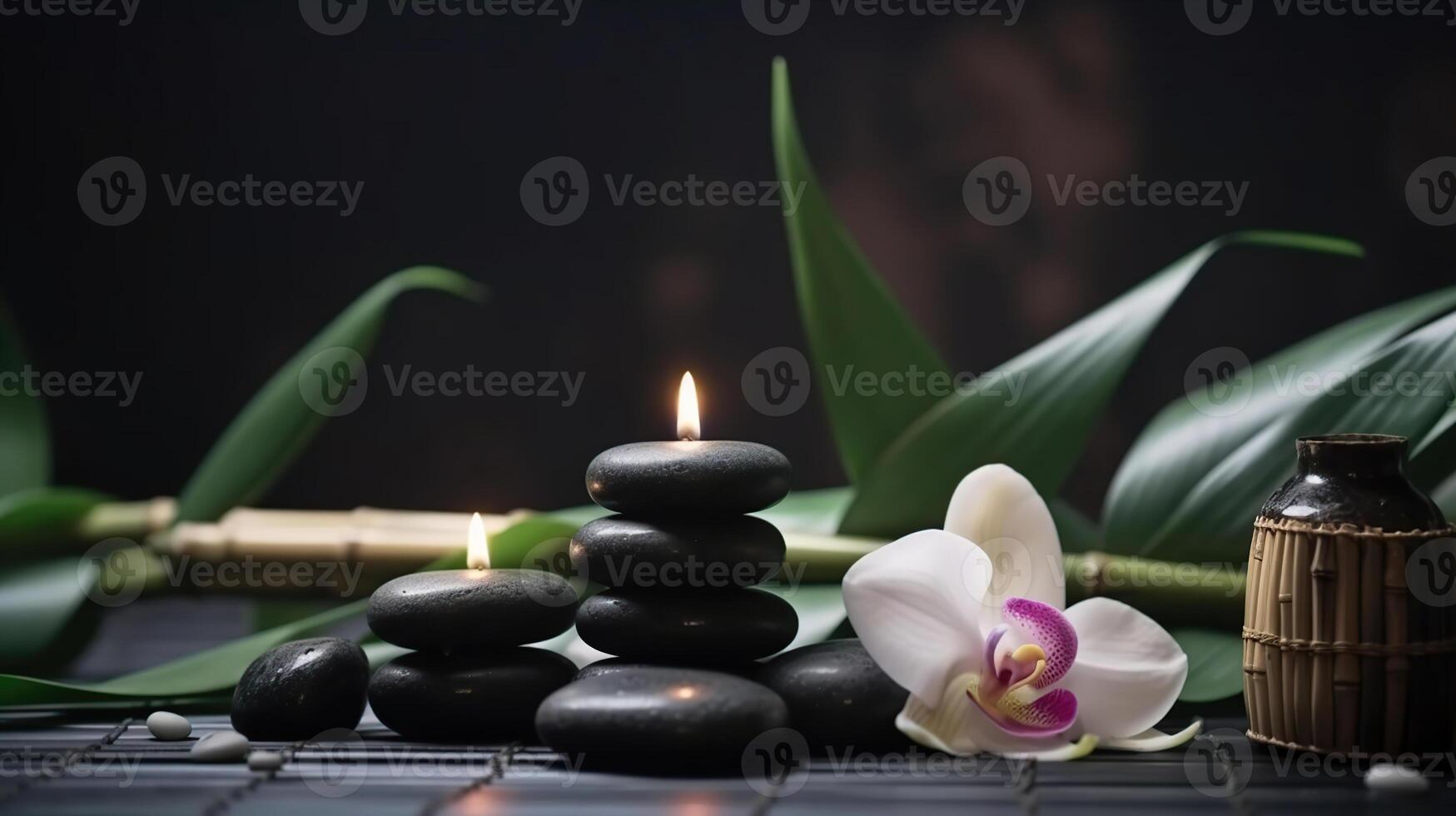 Spa still life with stacked of stone,burning candle and bamboo leaf, photo