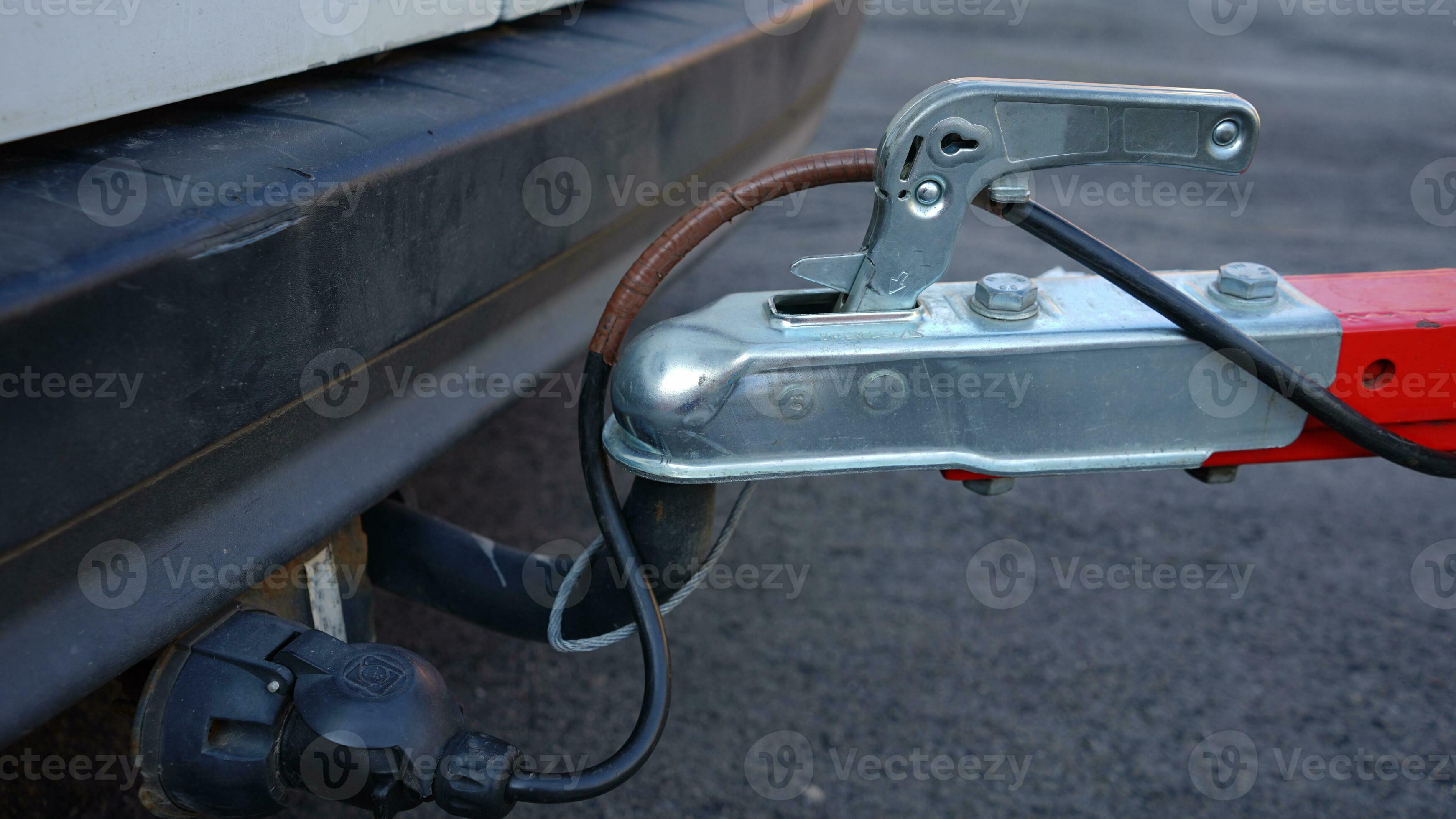 Trailer connected to car. Trailer on car's hook. Car hitch