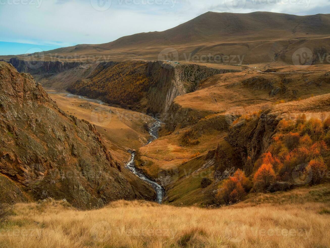 Autumn mountains in misty morning. Gil-Su valley in North Caucasus, Russia. Beautiful autumn landscape photo