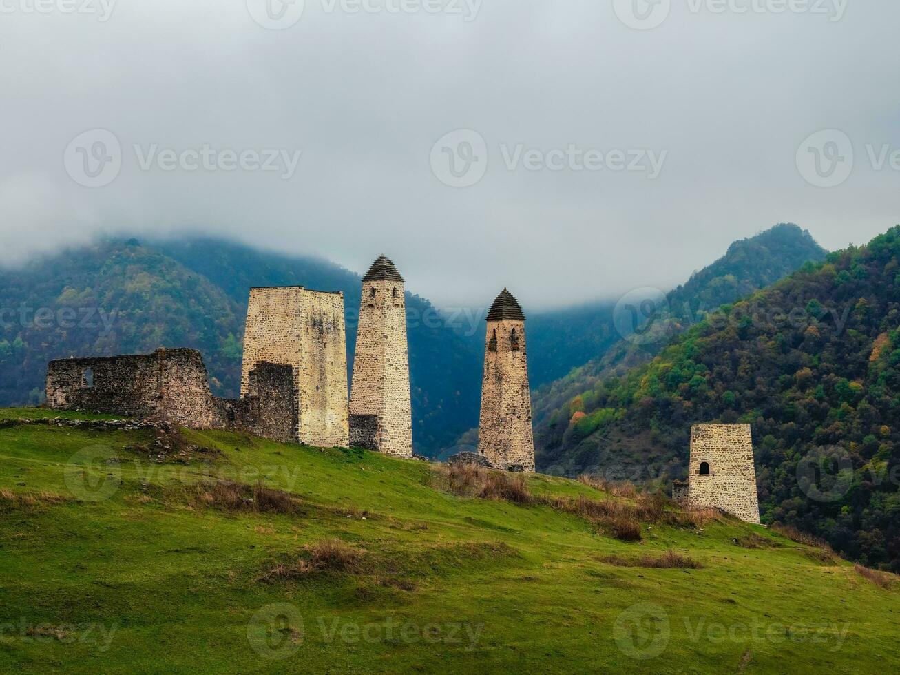 Majestic battle towers of Ingushetia. Historical monument, tourist attraction. Medieval tower complex Erzi, one of the largest medieval castle-type tower villages. photo