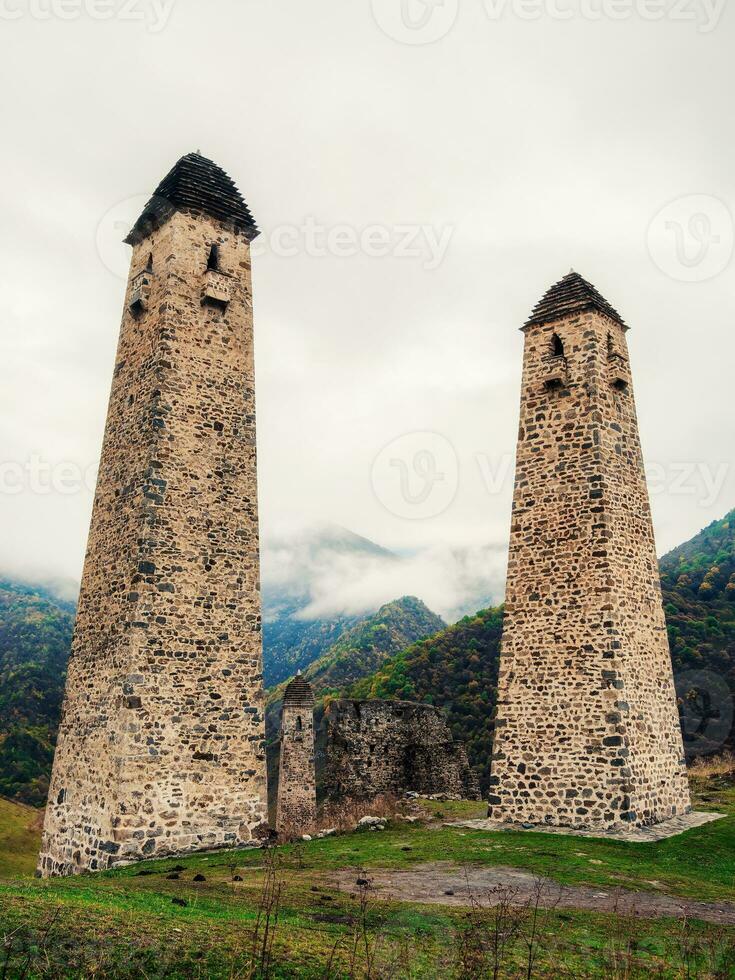 Majestic battle towers of Ingushetia. Historical monument, tourist attraction. Medieval tower complex Erzi, one of the largest medieval castle-type tower villages. photo