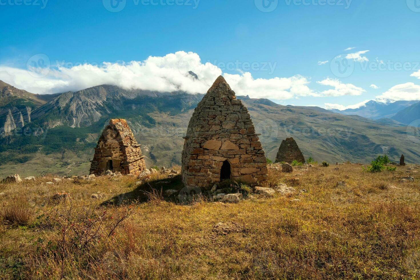 Old stone tomb, a crypt on the top of a mountain. Ossetia region. photo