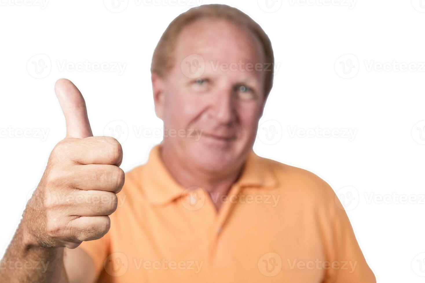 Handsome old man in orange polo-shirt shows thumb up photo