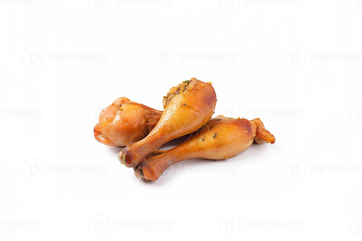 Delicious baked chicken drumsticks in honeymustard marinade isolated on white background. photo