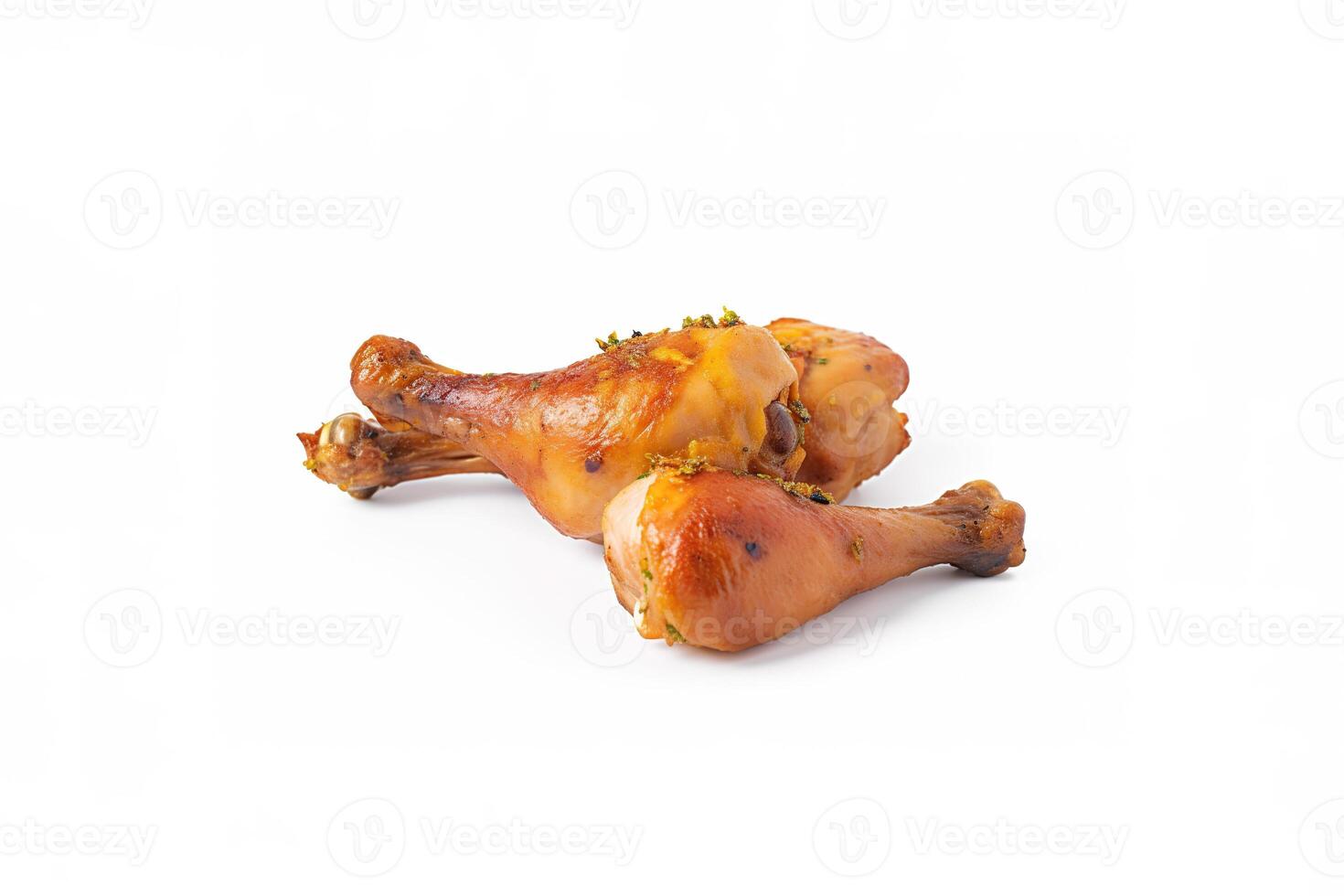 Delicious baked chicken drumsticks in honeymustard marinade isolated on white background. photo