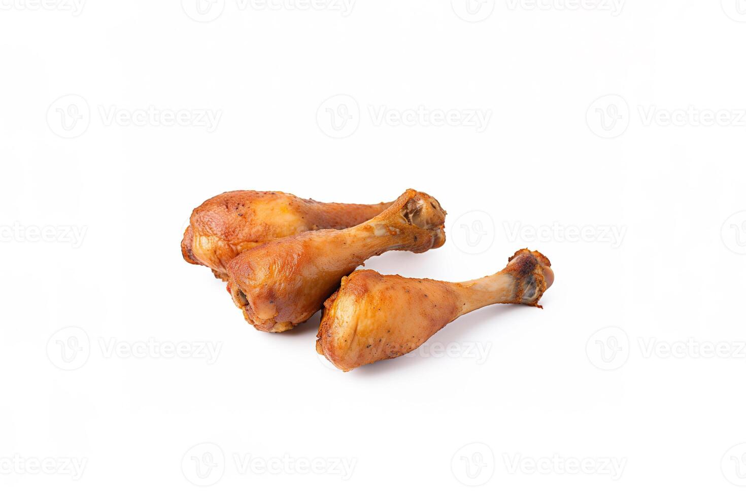 Delicious baked chicken drumsticks in honeymustard marinade isolated on white background. photo