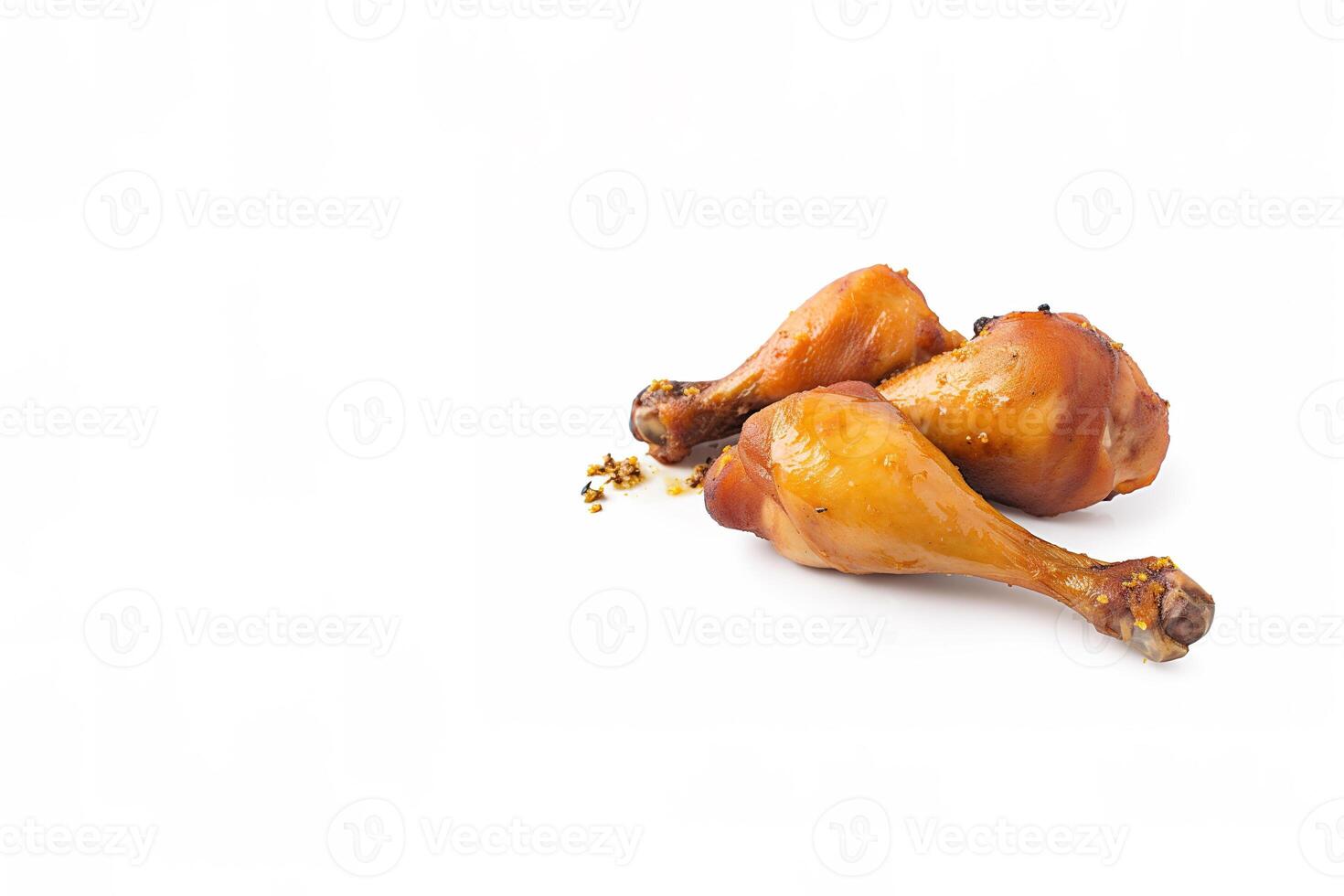 Delicious baked chicken drumsticks in honeymustard marinade isolated on white background with copy space. photo