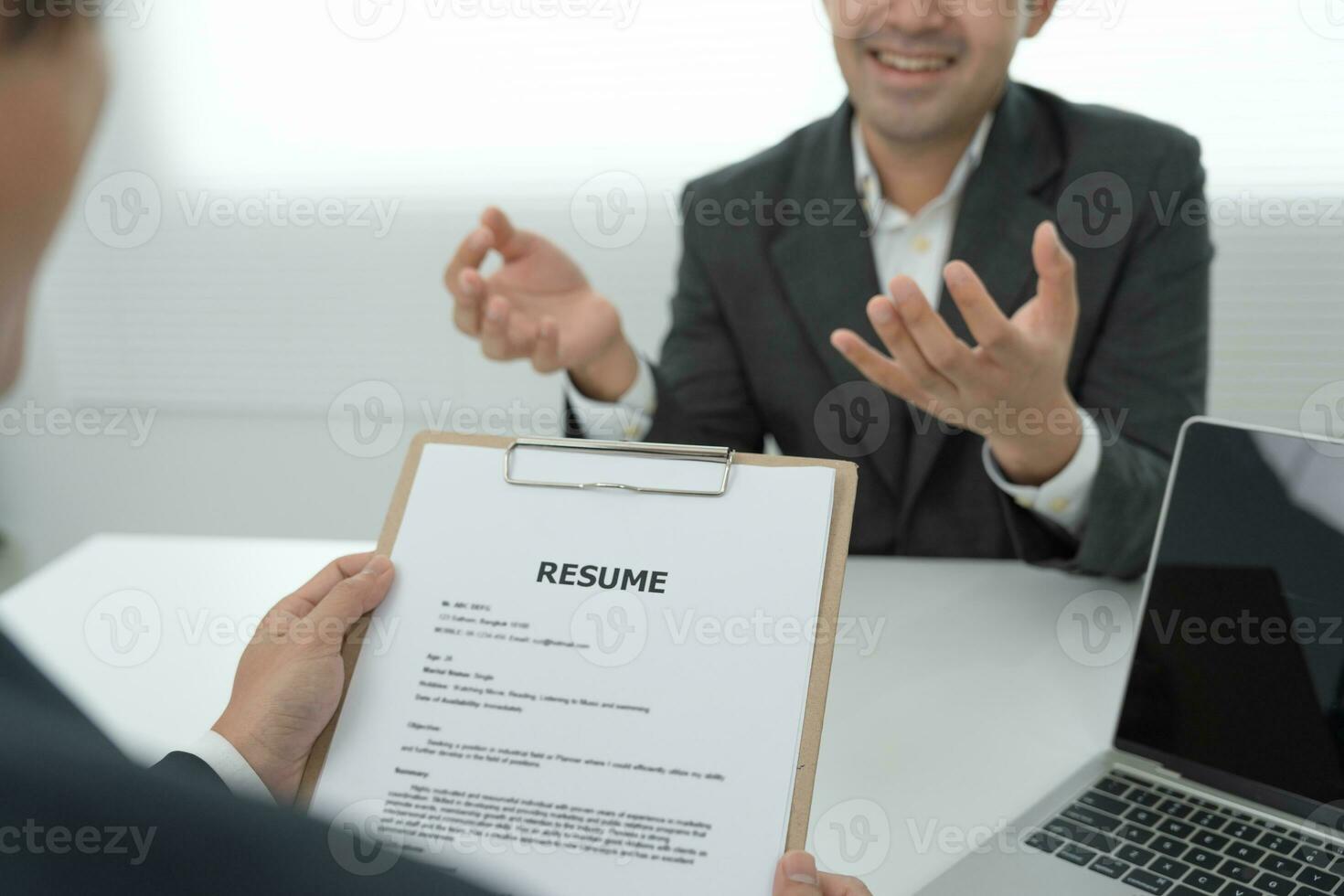 Executives accept job application documents and read job applicants resume to match the position. company publishes vacancies online to find human. Human resource, interview, letters, competence. photo