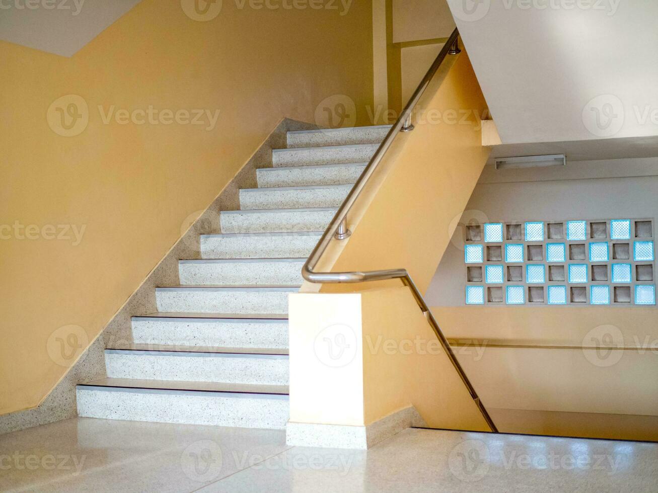 Stairways are concrete in multi-storey buildings and have steel handrails. photo