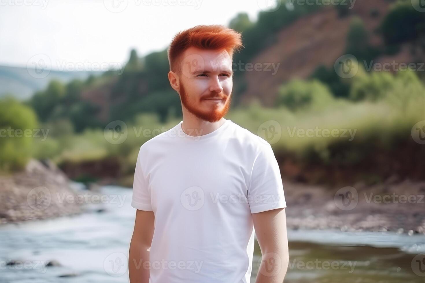 content, Mokkap, a man with a red beard in a white T-shirt on the background of nature. Place for design. photo